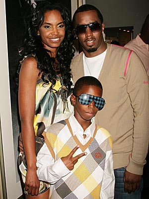 Christian Combs poses with parents Diddy and Kim Porter at the VIP reception for The Rock 'N' Roll of Hip Hop