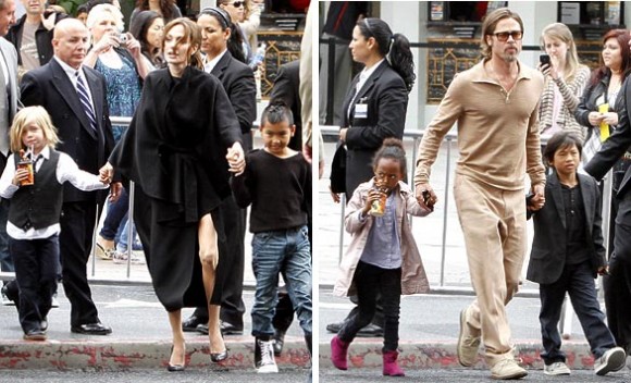 After catching the movie, Angelina and Brad hold on to Shiloh, 4, Maddox, 9, Zahara, 6, and Pax, 7