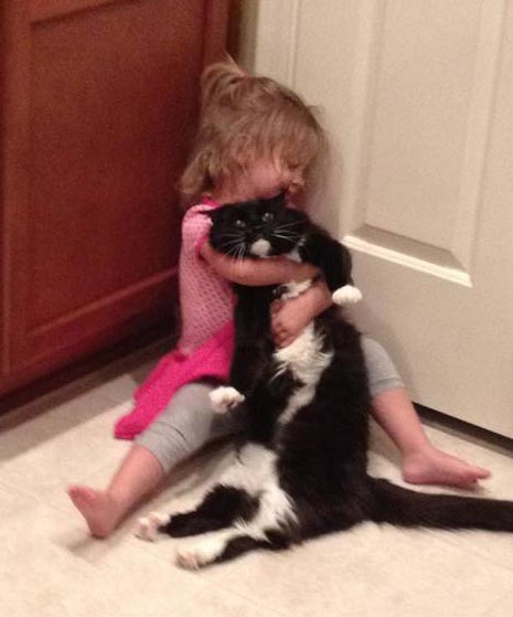 girl-hugging-cat.jpg